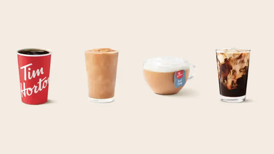 A Tim Hortons brewed coffee, Original Iced Capp, London Fog and Vanilla Cream Cold Brew side by side