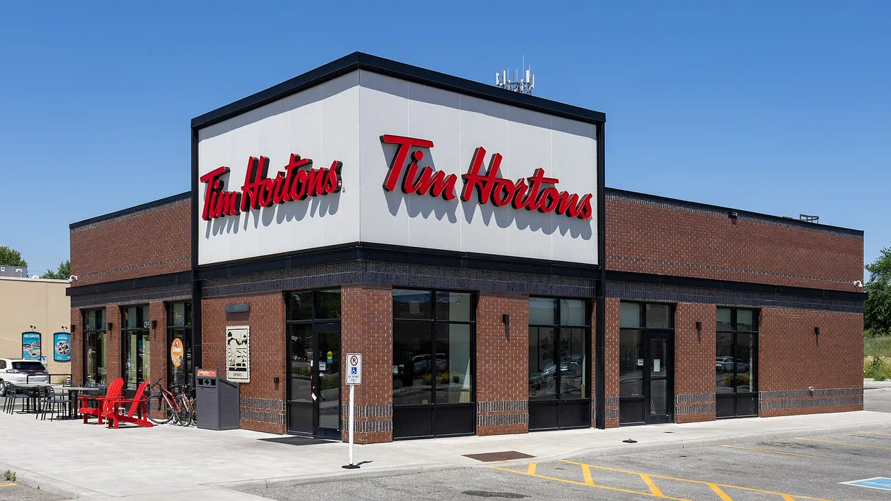 A Tim Hortons restaurant with a red and white sign in Kingsville, Ontario