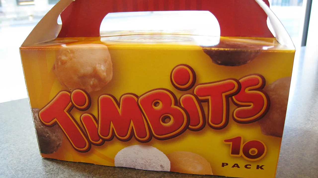 A 10-pack box of Tim Hortons Timbits on a restaurant table