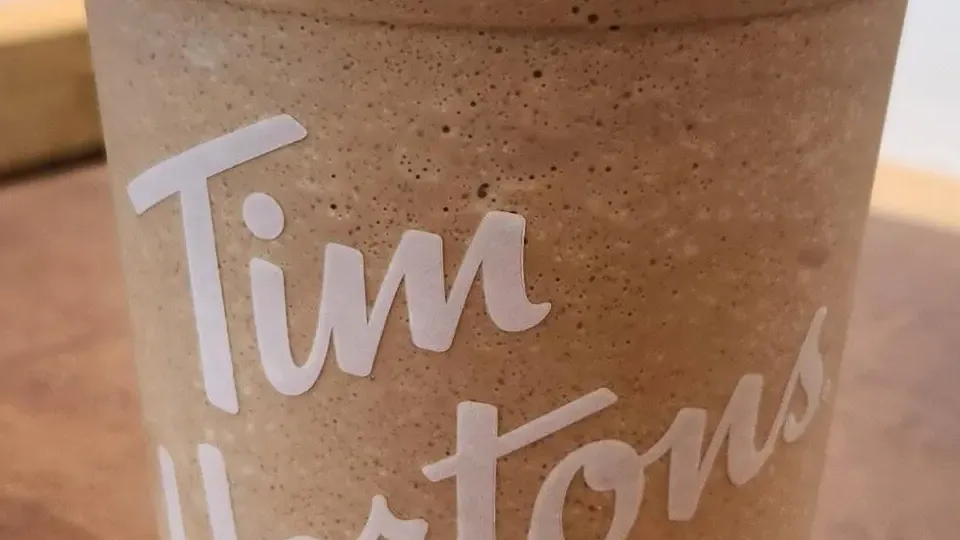 A blended Tim Hortons Iced Capp in a clear branded cup
