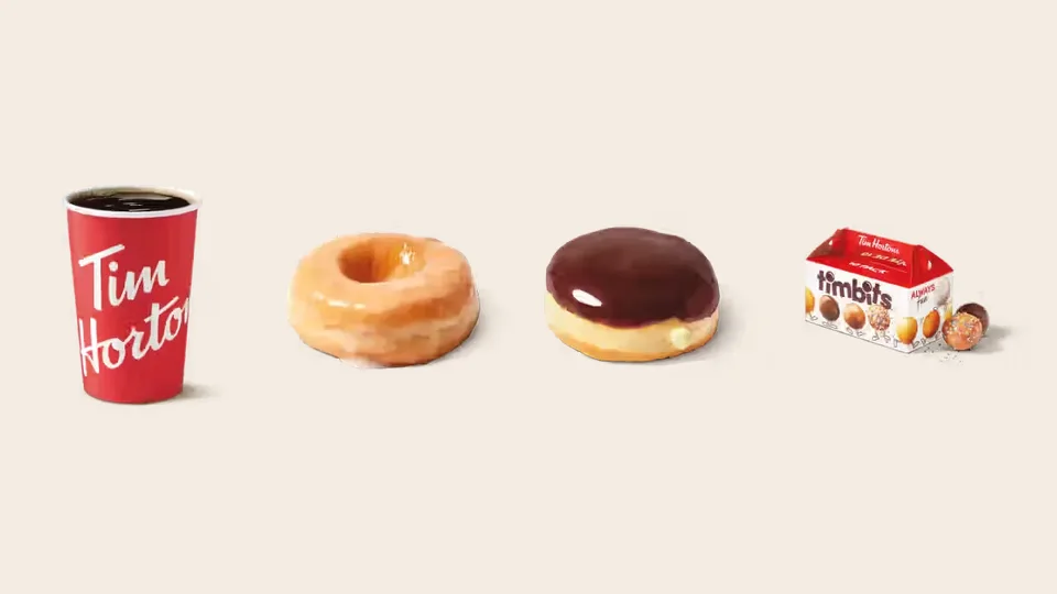 A Tim Hortons brewed coffee, Honey Dip donut, Boston Cream donut and box of Timbits